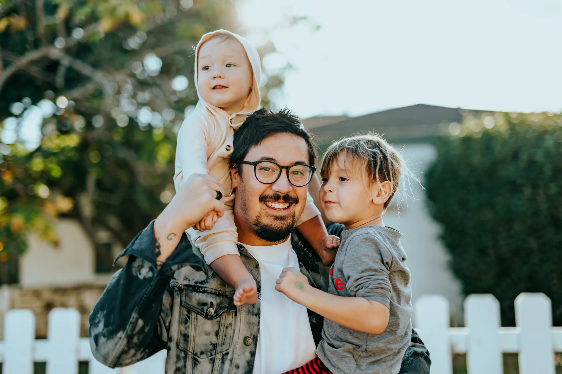 Father with two children outside