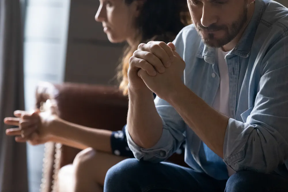 Couple sitting worried