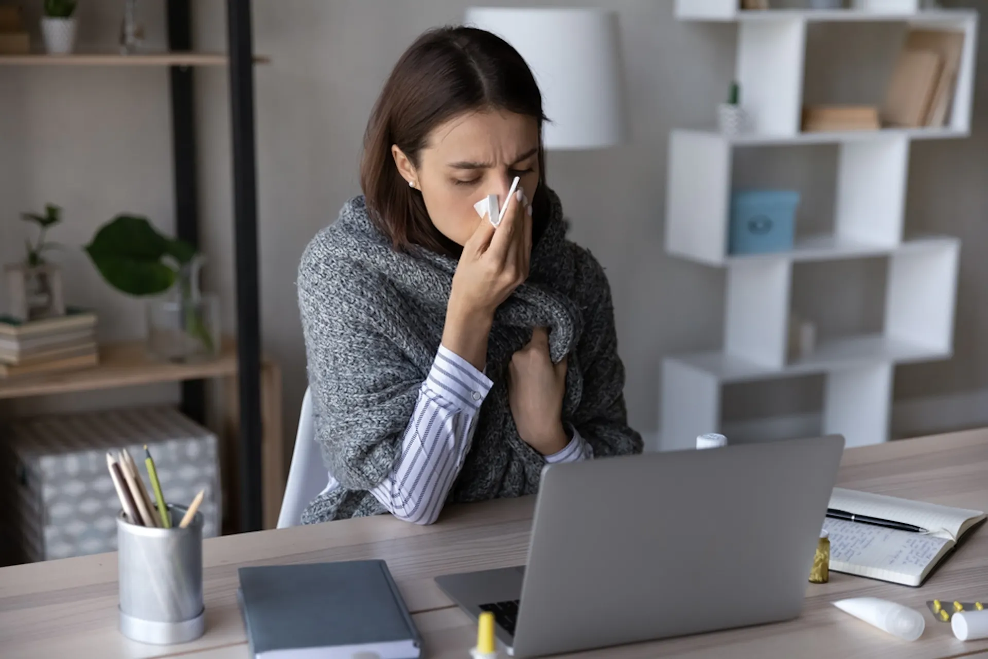 Woman sick at computer