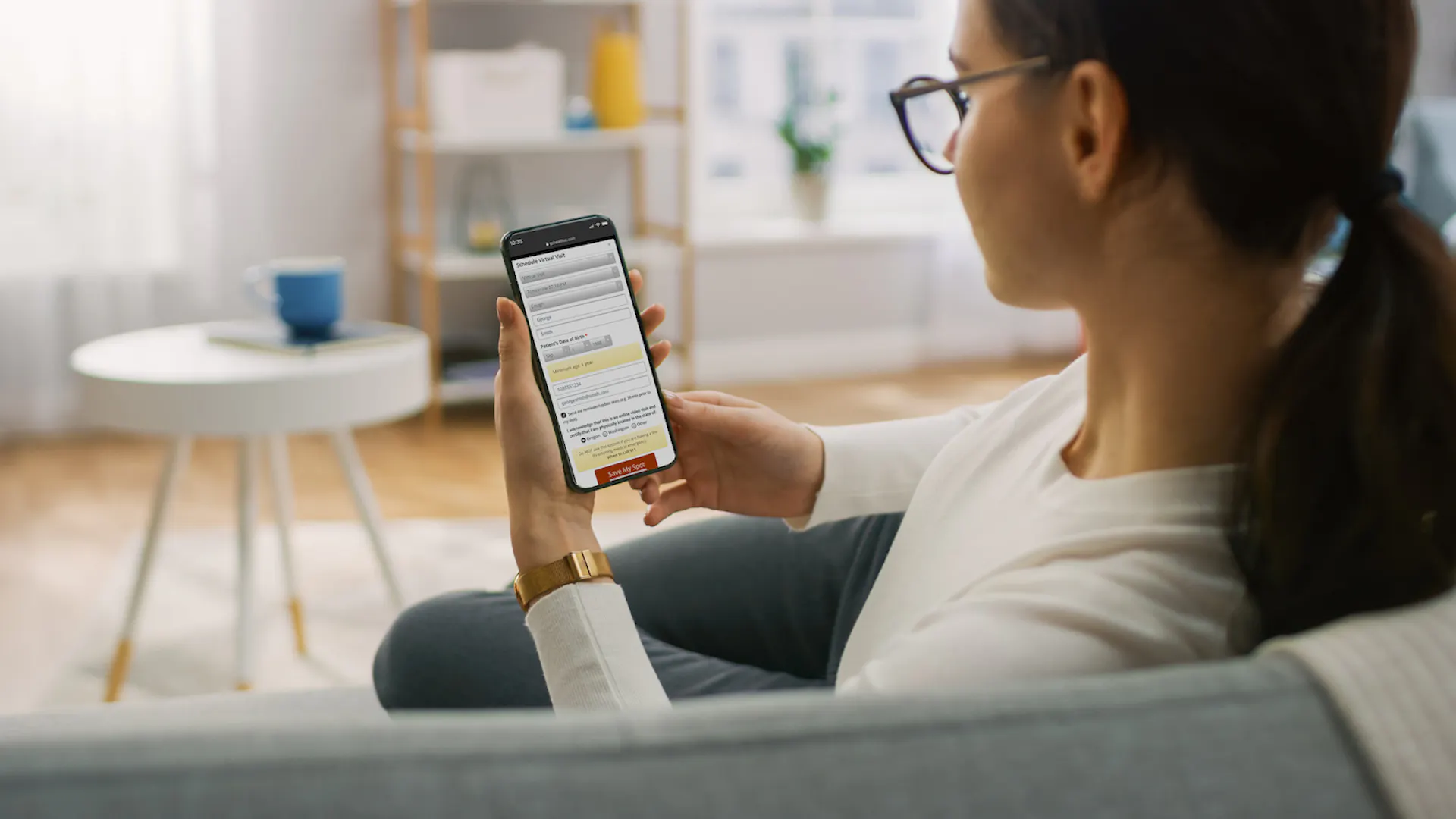 Woman using the GoHealth UC app on her phone
