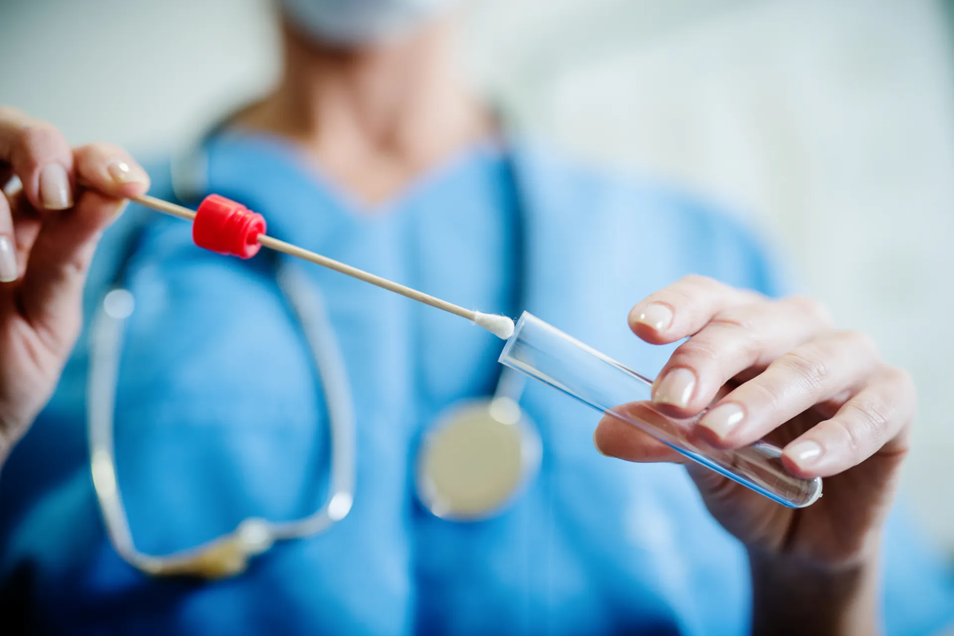 provider holding a swab test