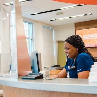 GoHealth receptionist typing on computer