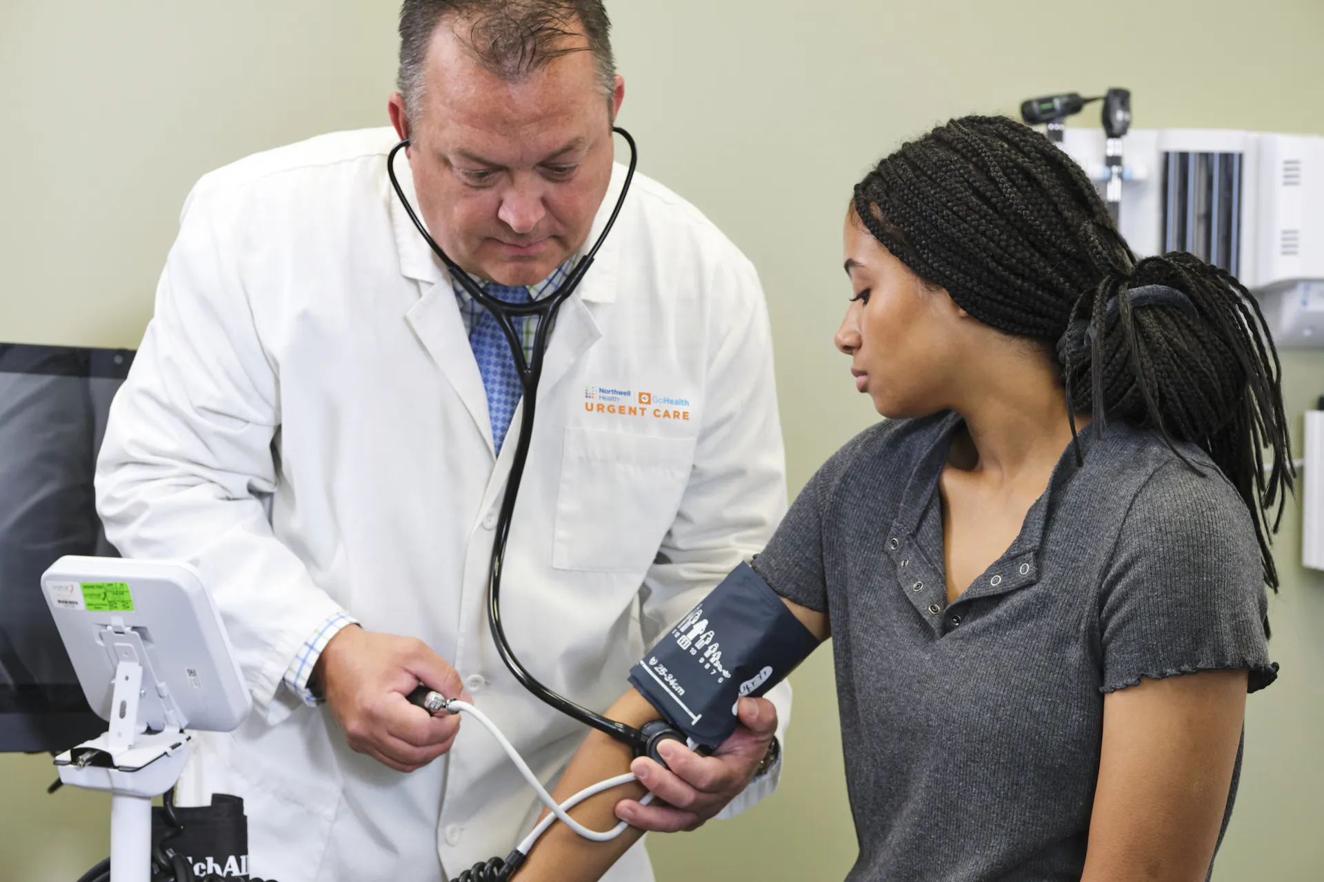 Northwell Health-GoHealth Provider checking patient's blood pressure