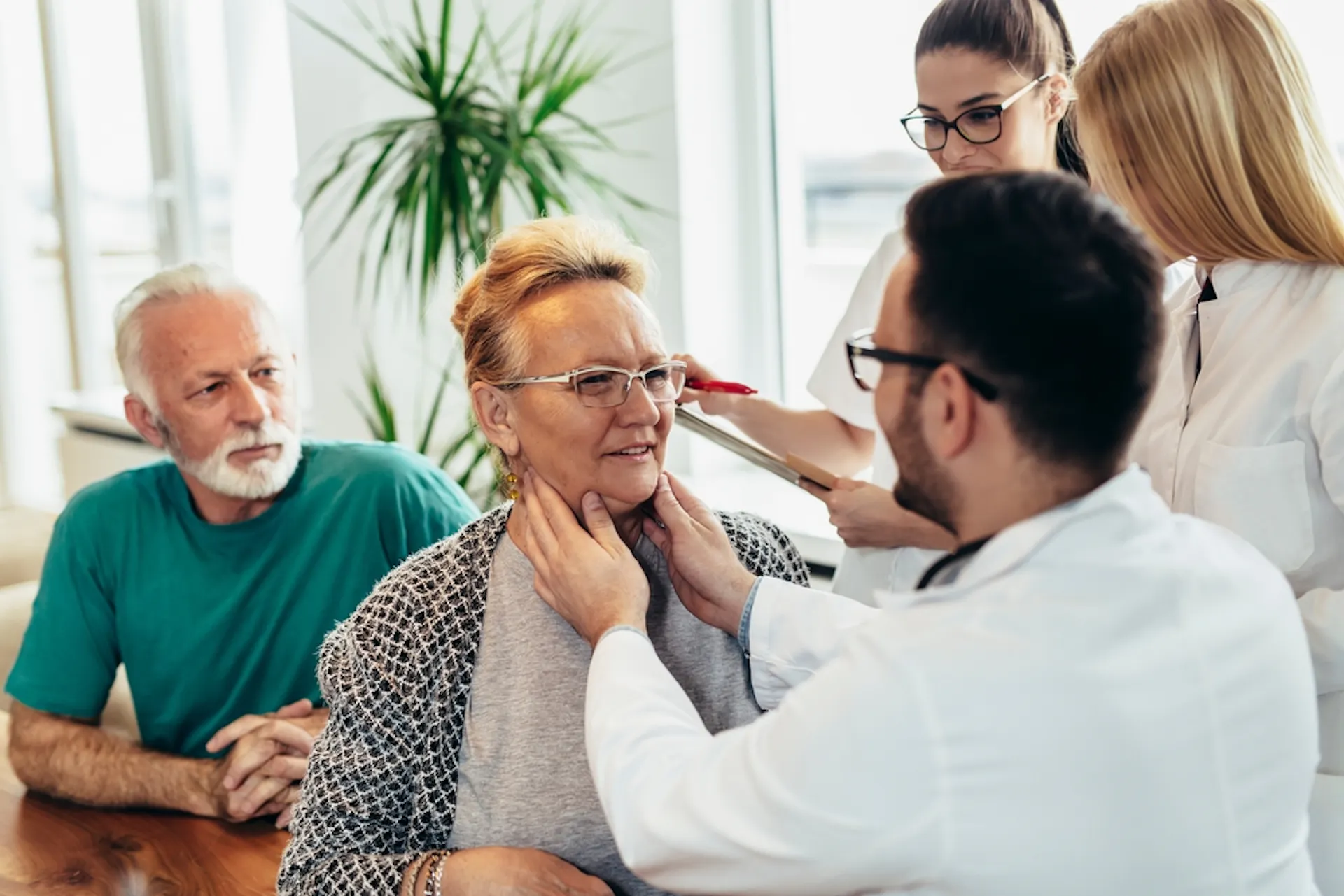 An elderly couple seeing a doctor 