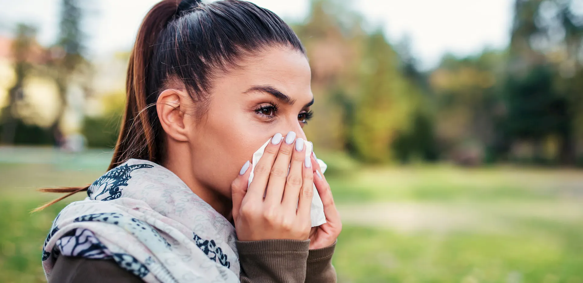 A woman suffering from rhinitis