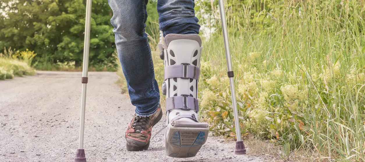 A man walking with a splint