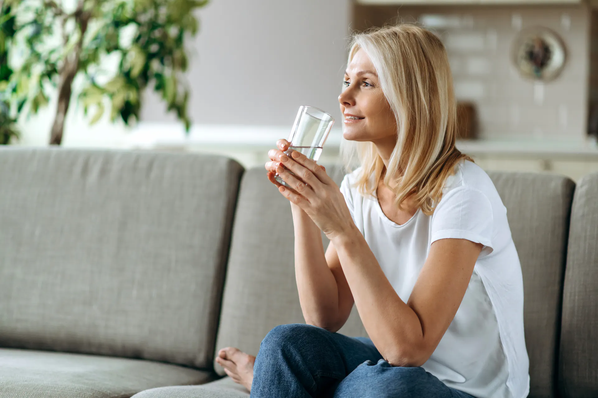Woman sitting and drinking water