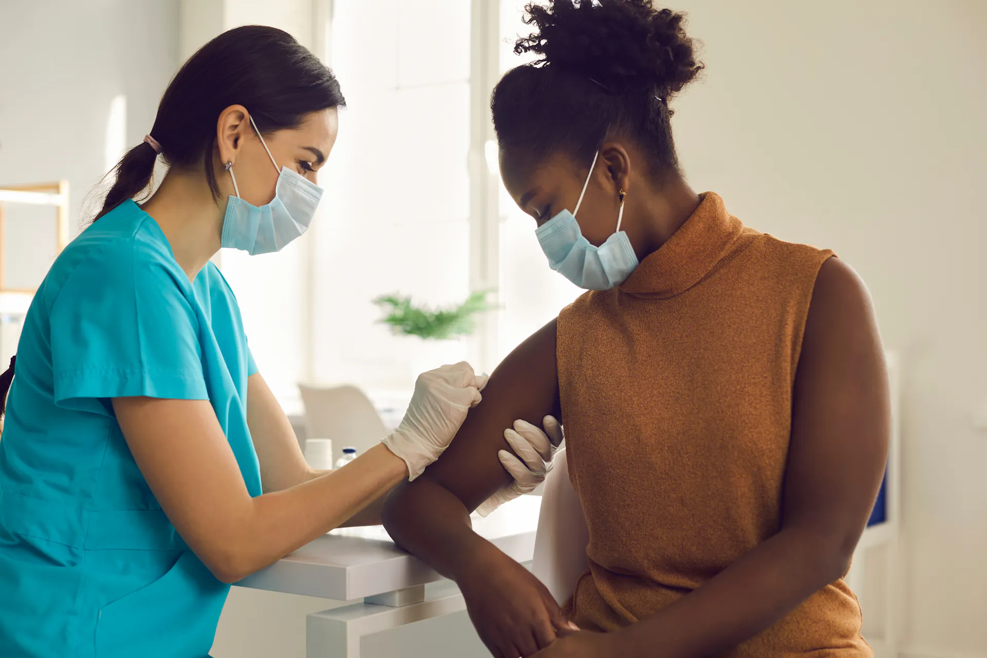 Provider giving a woman a flu shot