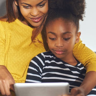 mom and daughter on tablet