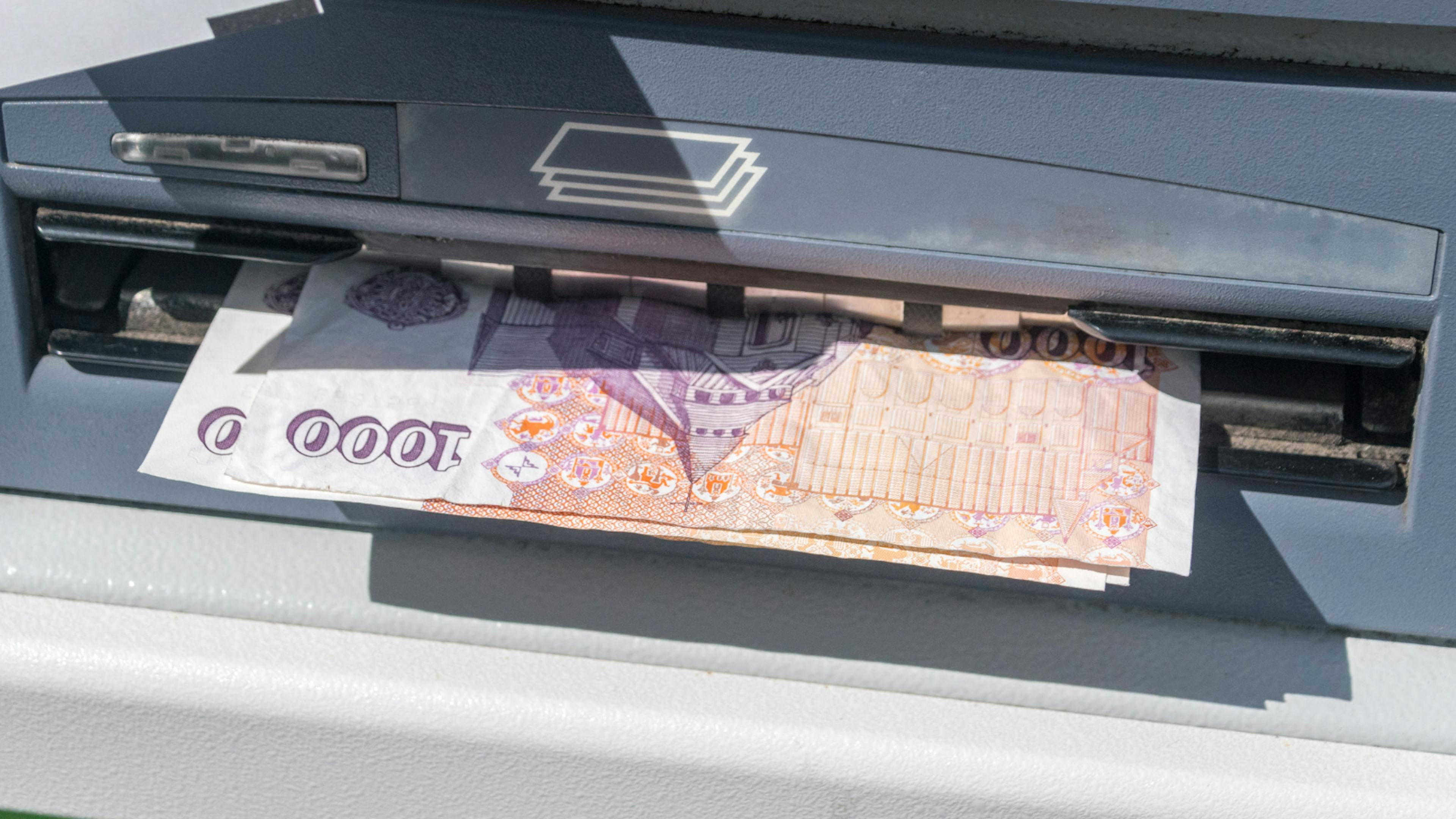 Krona notes coming out of an ATM in Iceland
