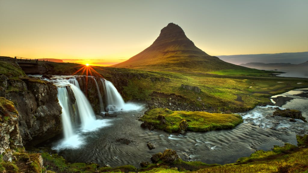 Kirkjufell mountain and waterfall at sunset.