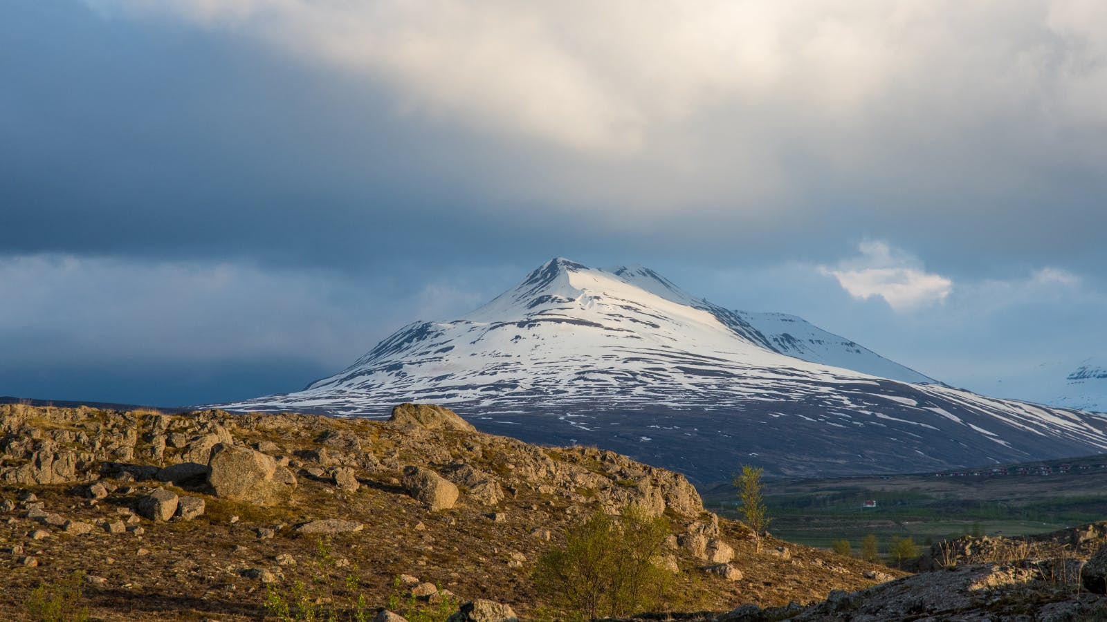 Mount Sulur near Akureyri covered in snow.