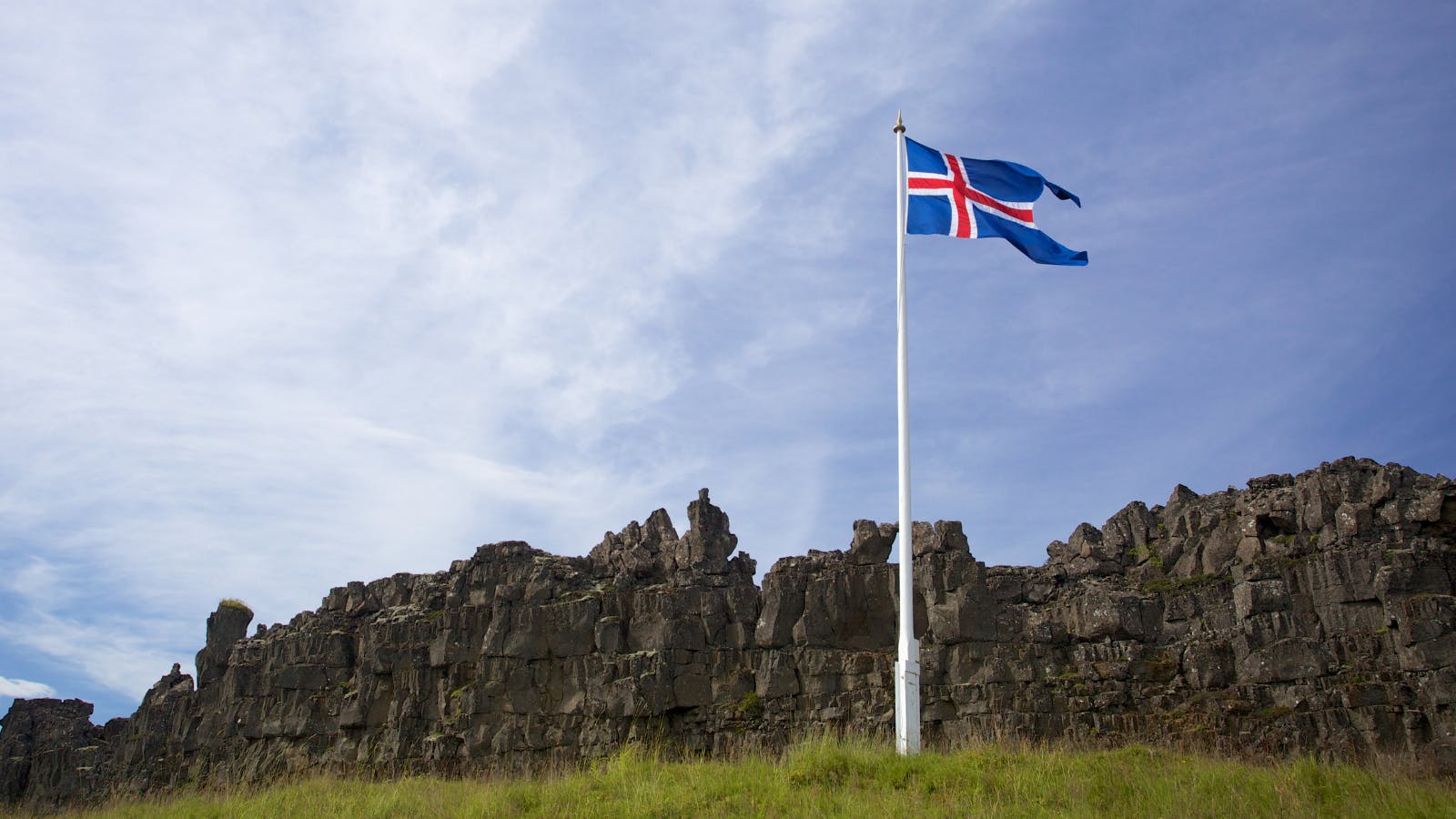 Icelandic flag with natural landscape.