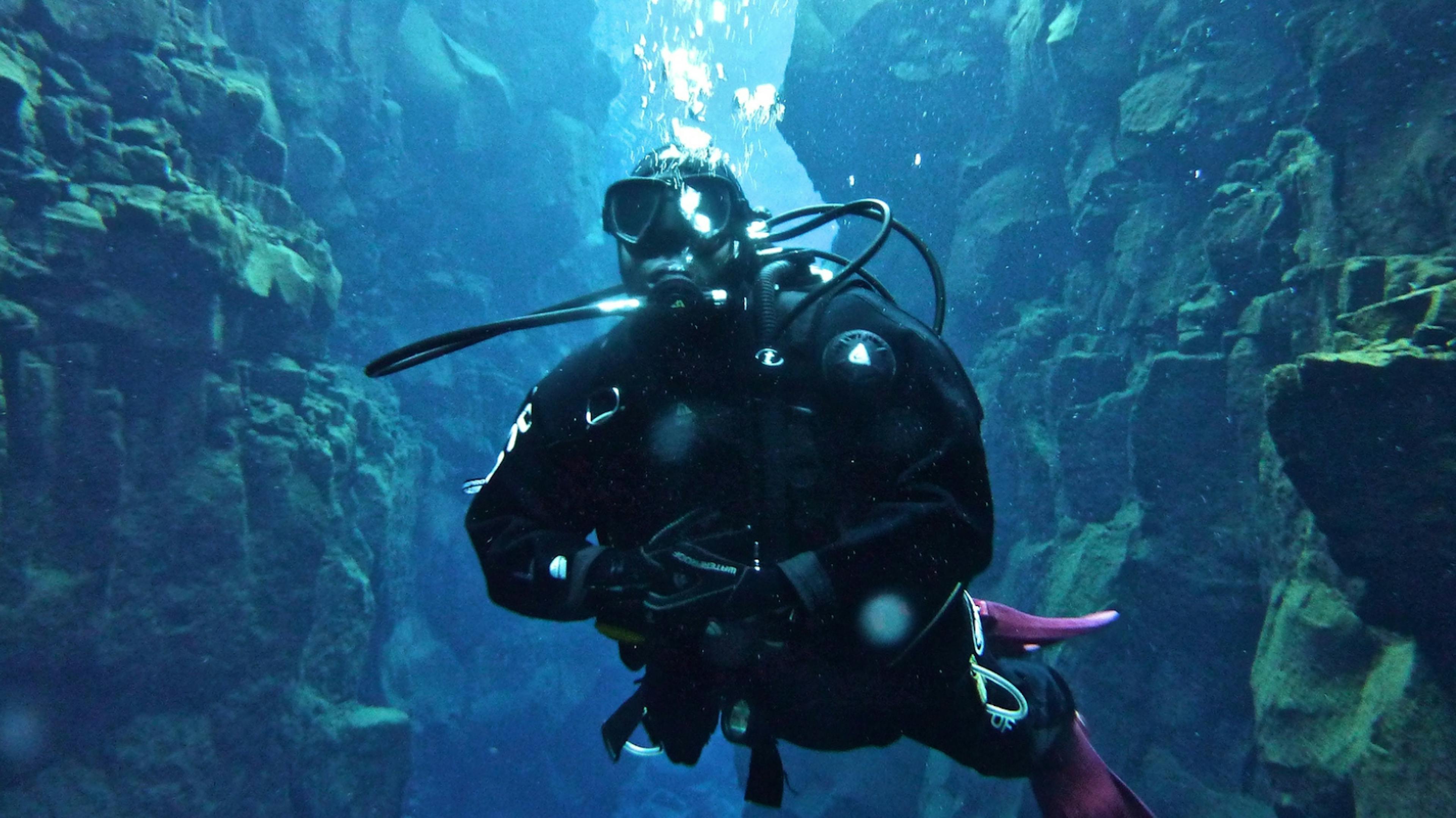 Underwater diver at Silfra Fissure in Iceland