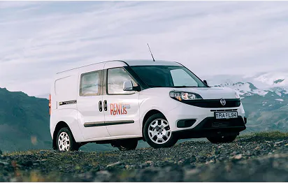 A white camper parked on an F-road in Iceland