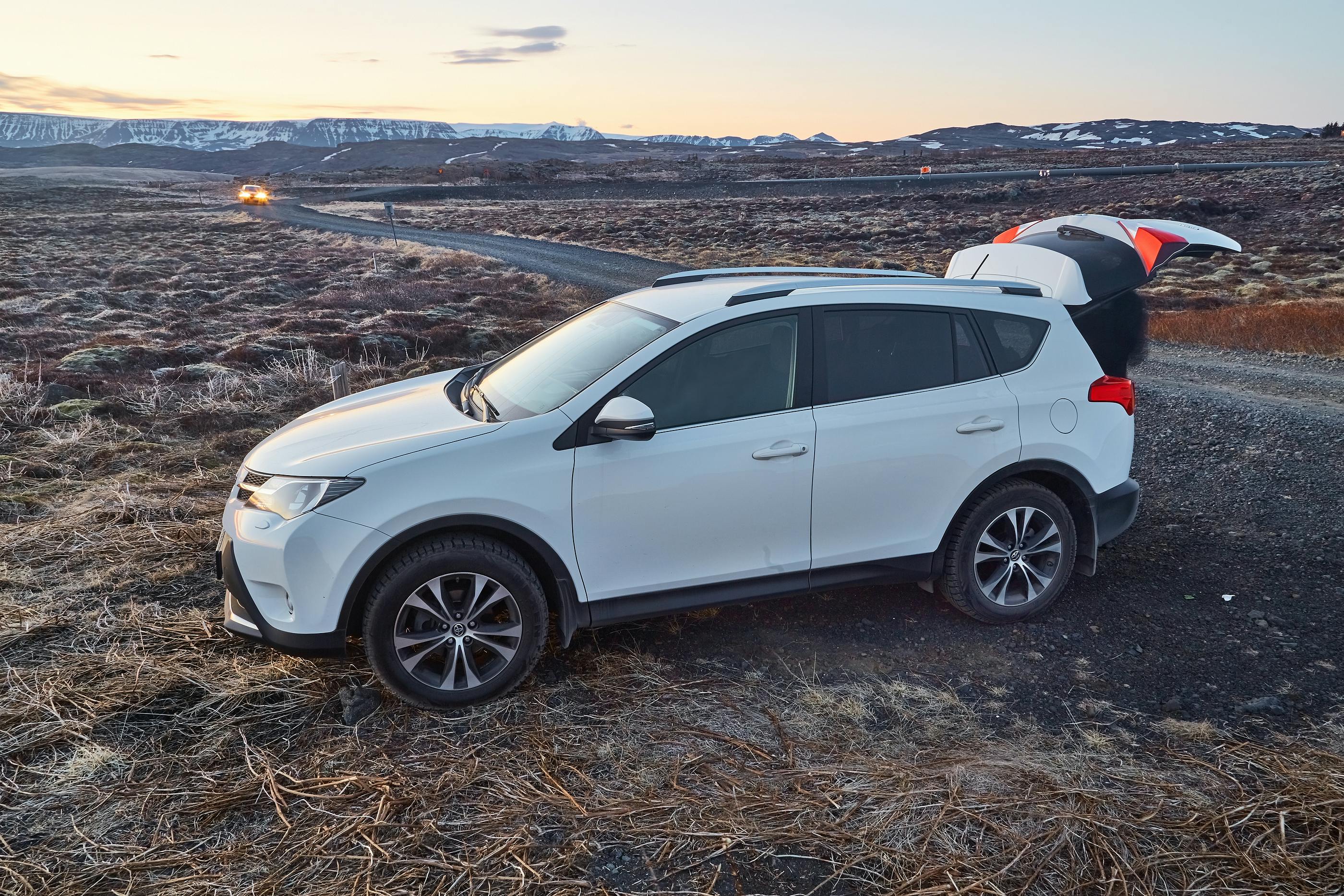 Toyota Rav4 parked on the side of a gravel road in Iceland.