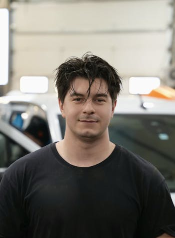 A Maintenance staff member posing for a photo