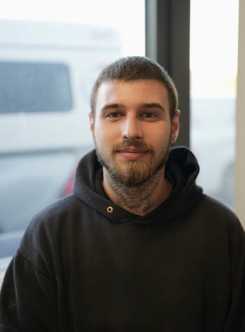 A Maintenance staff member posing for a photo