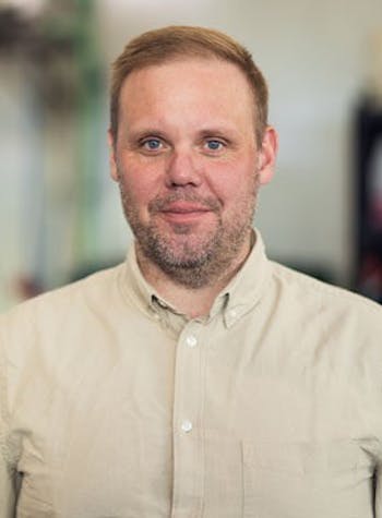 OWNER AND CEO posing for a photo