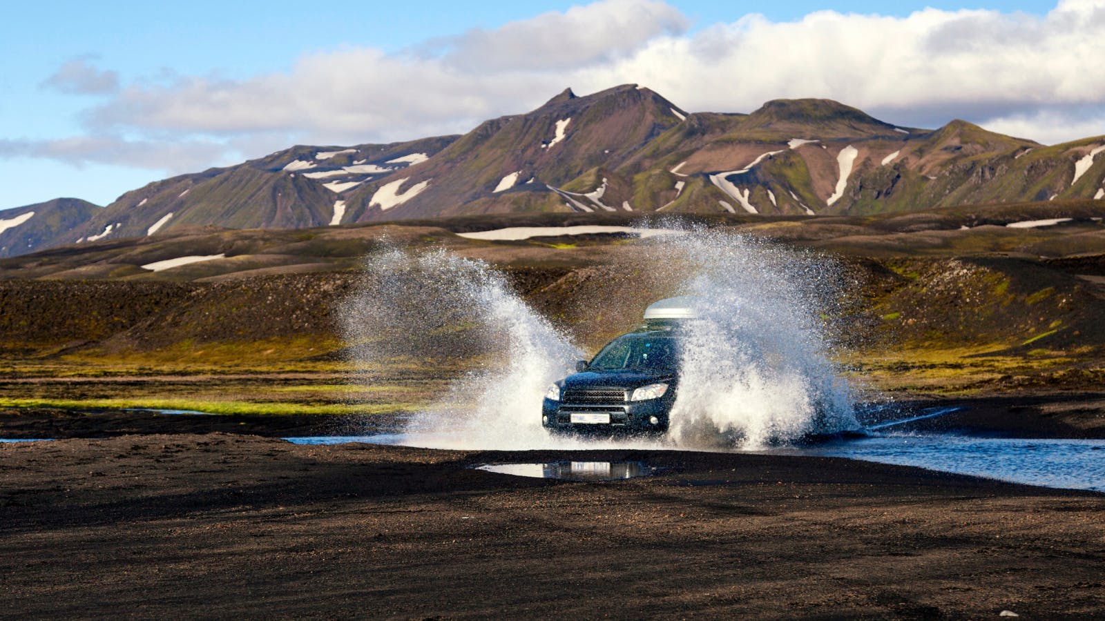 4x4 crossing a river on an F-Road in Iceland.