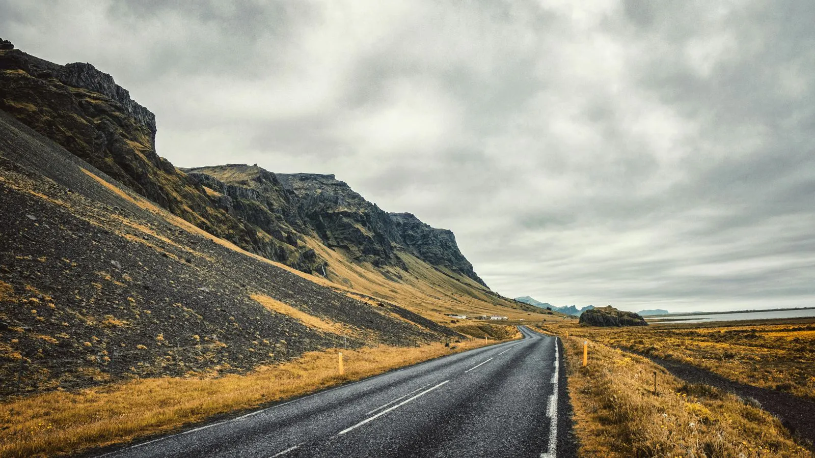 Open Icelandic road on a cloudy day.