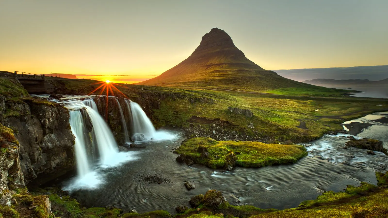 Kirkjufell mountain and waterfall at sunset.