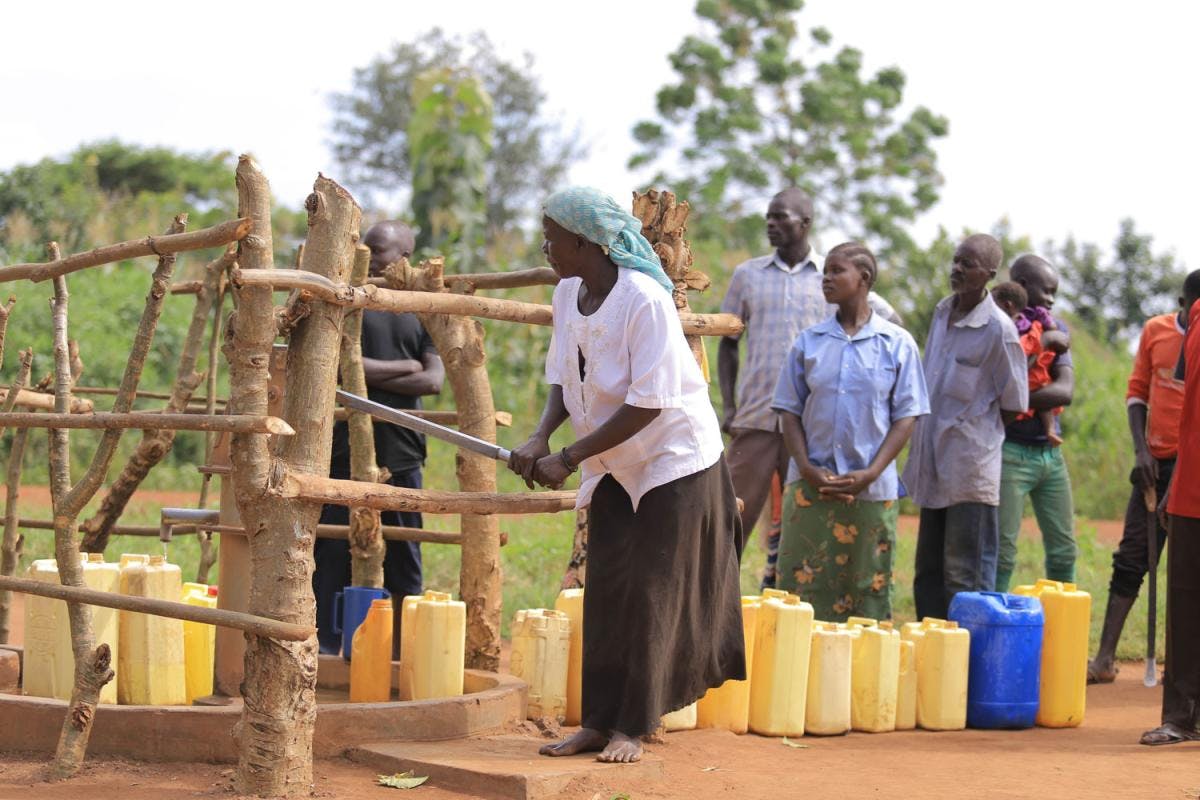 LANGO Project Woman at the borehole