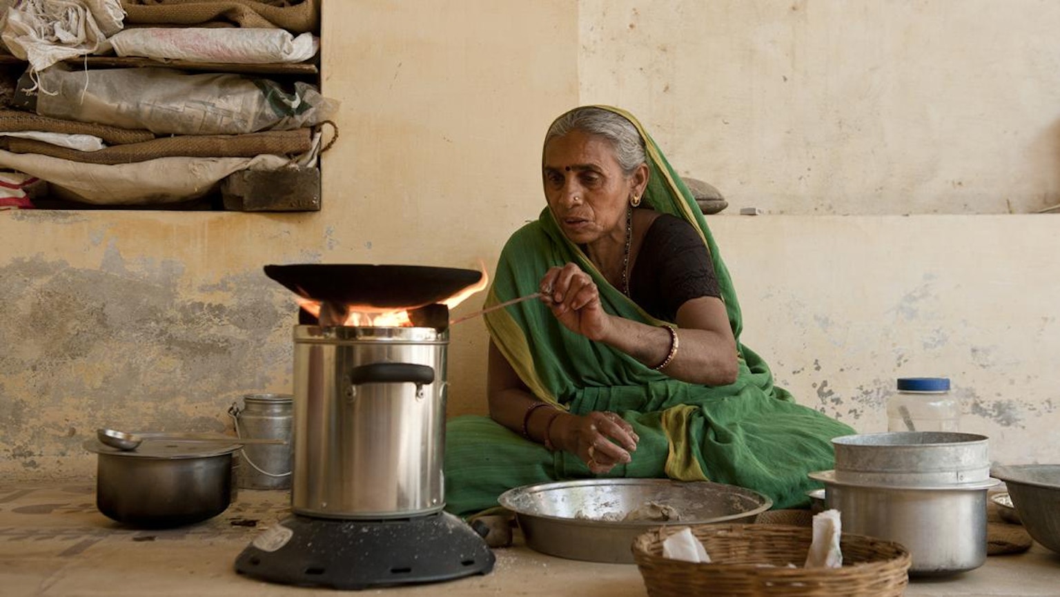 Woman using an improved cookstove