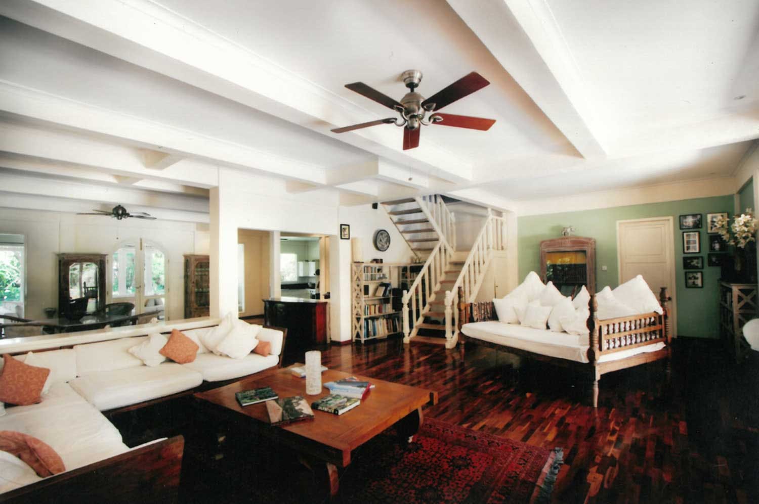 Inside the family home, the dark teak floors remain a part of Goldust's present day beauty.