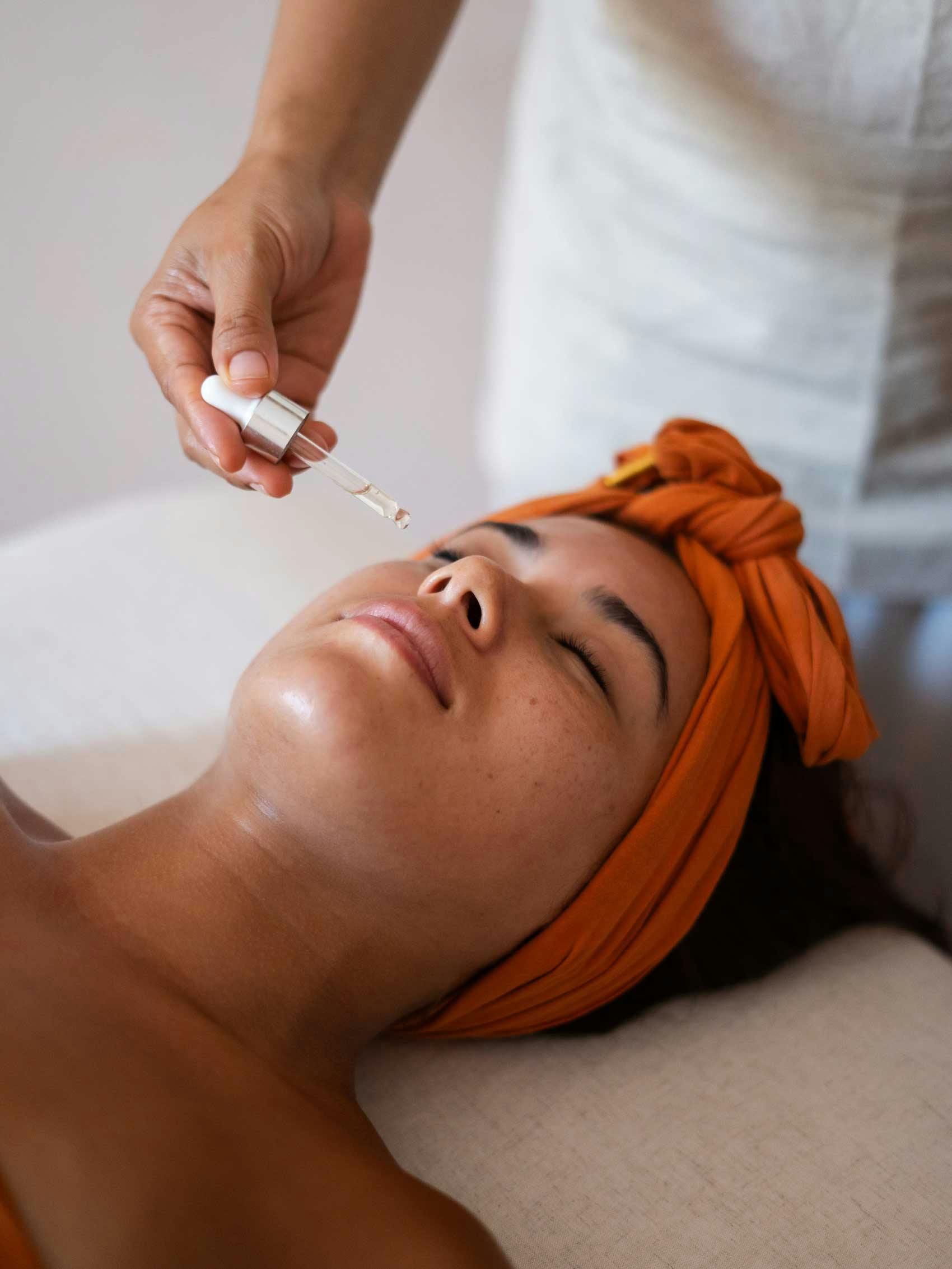 Client enjoying a luxurious facial treatment at a top Bali spa