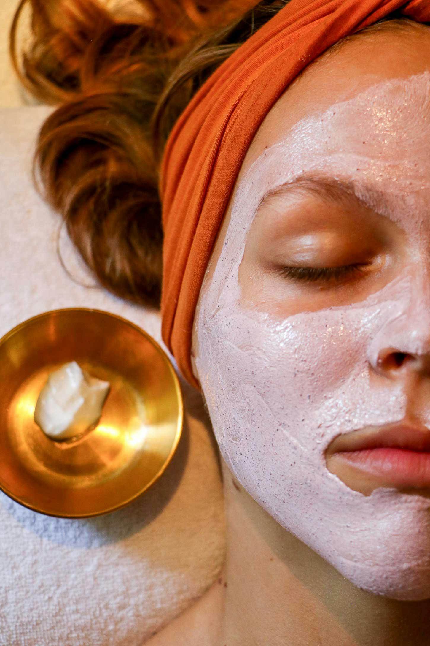 Girl laying with a luxurious facial mask