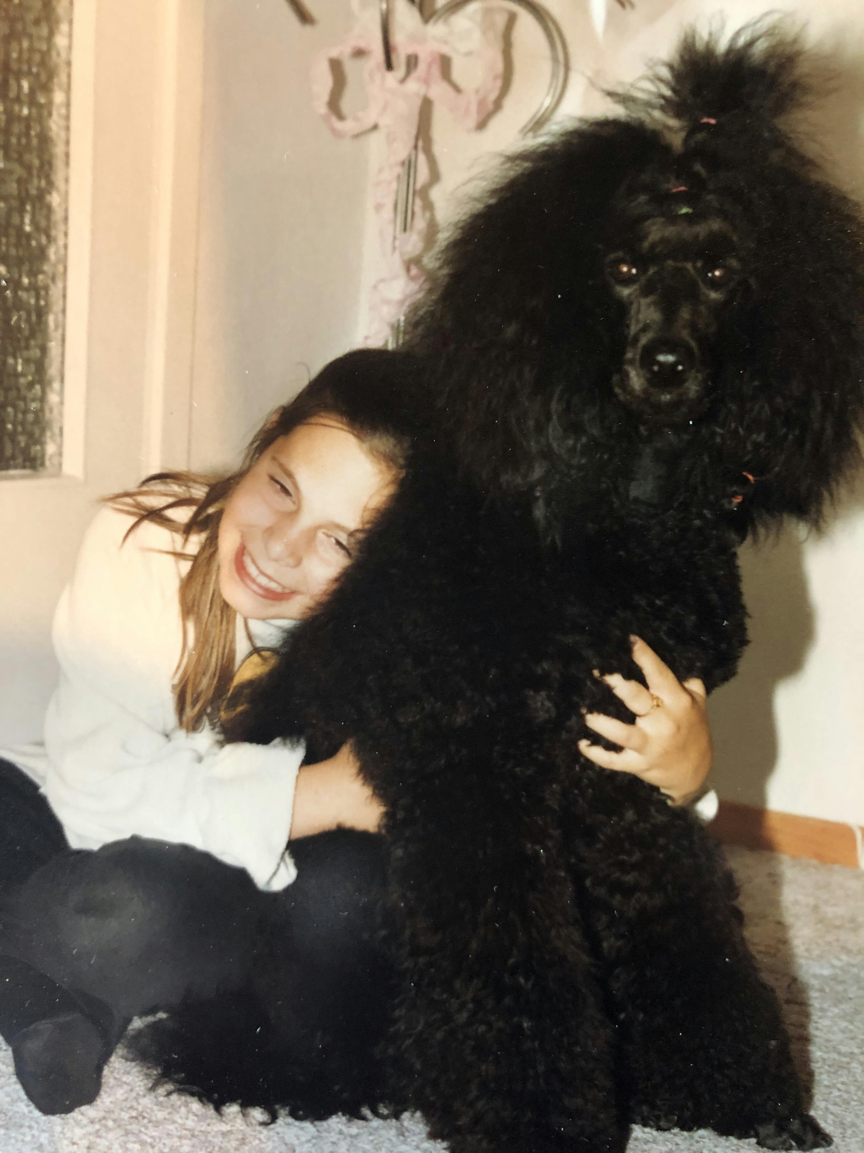Crystal and her childhood Poodle.