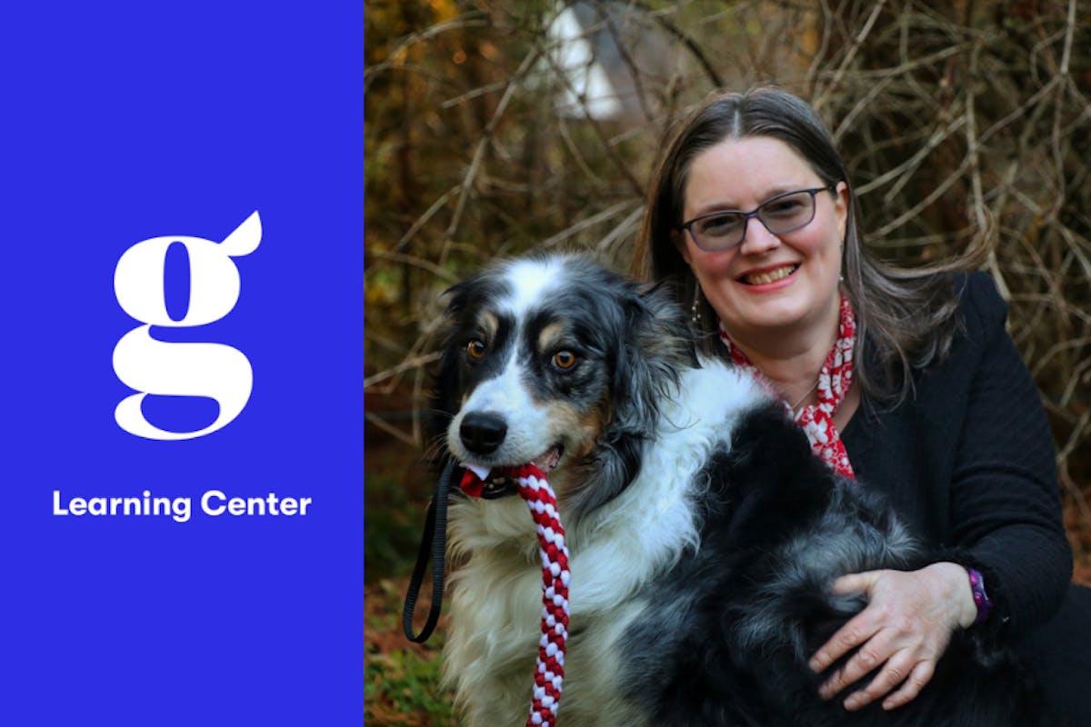 Author Zazie Todd smiles with Bodger, her Australian Shepherd.