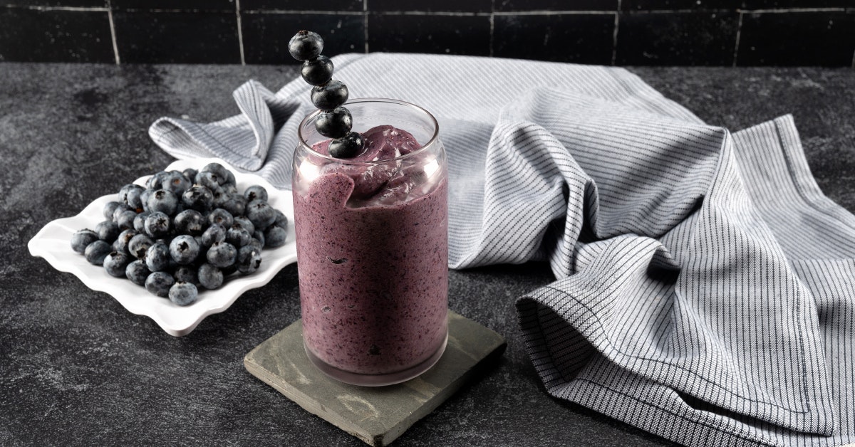 Blueberry mushroom smoothie on  a granite countertop