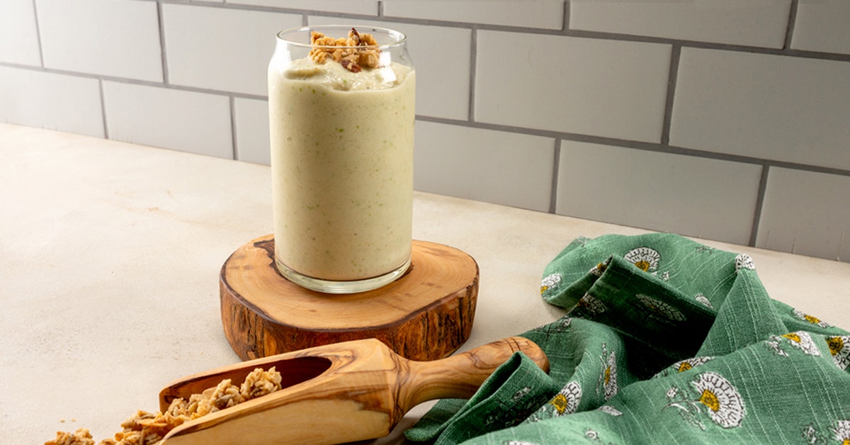 apple smoothie on a white countertop