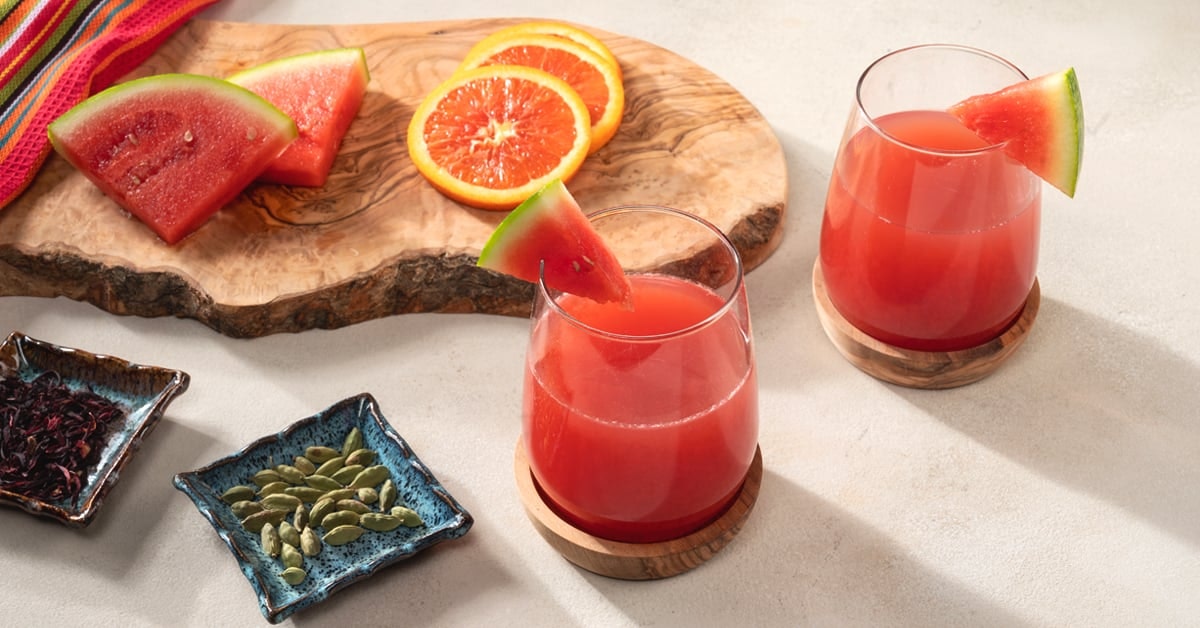 two glasses of watermelon juice on a table