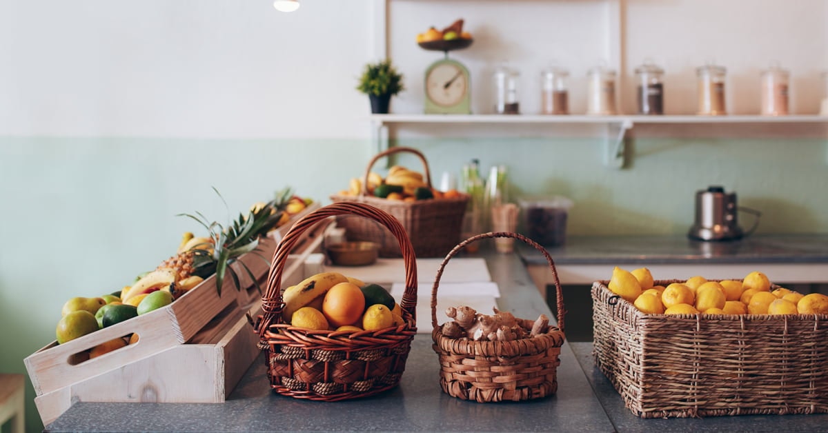 fruit in baskets on a juice bar counter