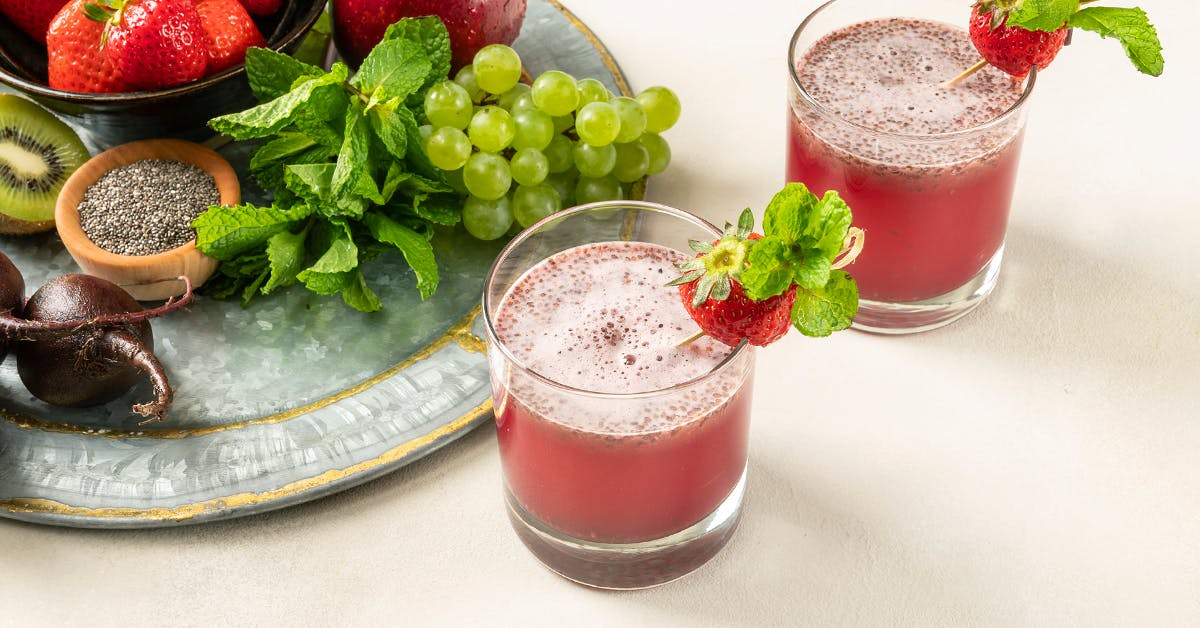 strawberry kiwi fruit juice recipe on a table with ingredients