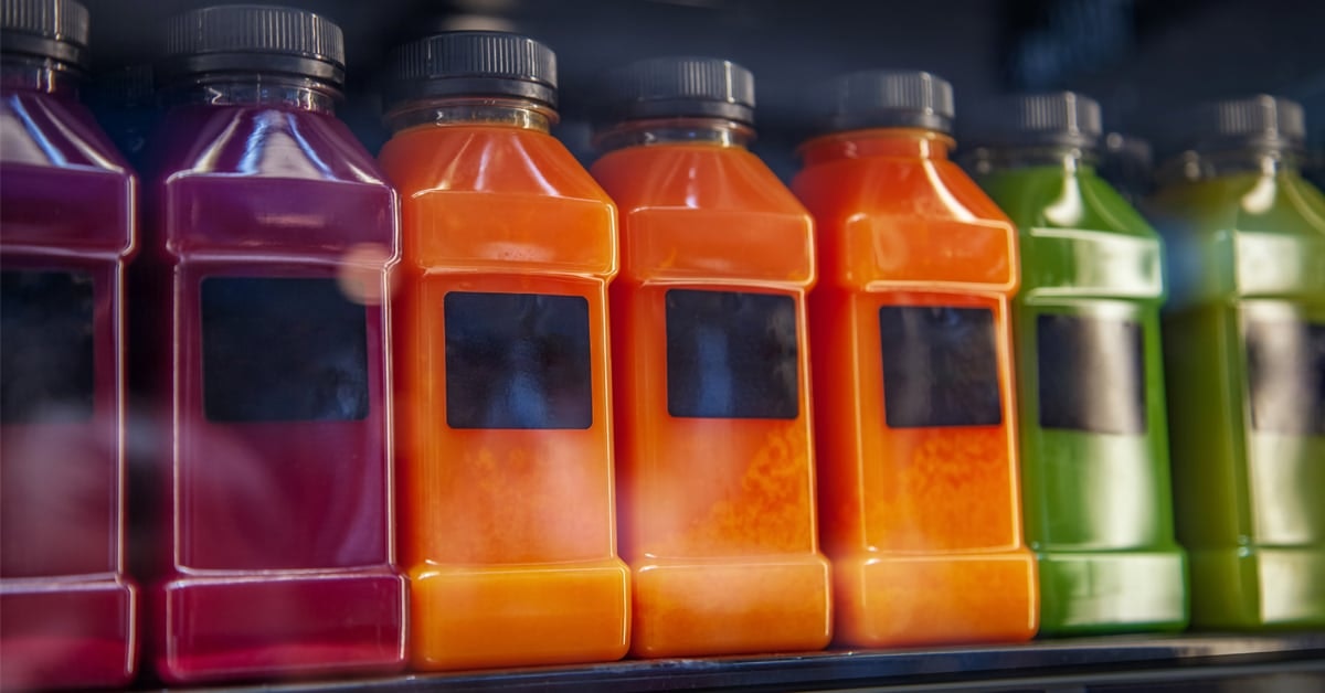 bottles of fresh juice in a cooler