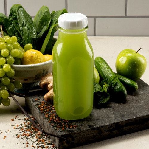 premium glass juice bottle with green juice