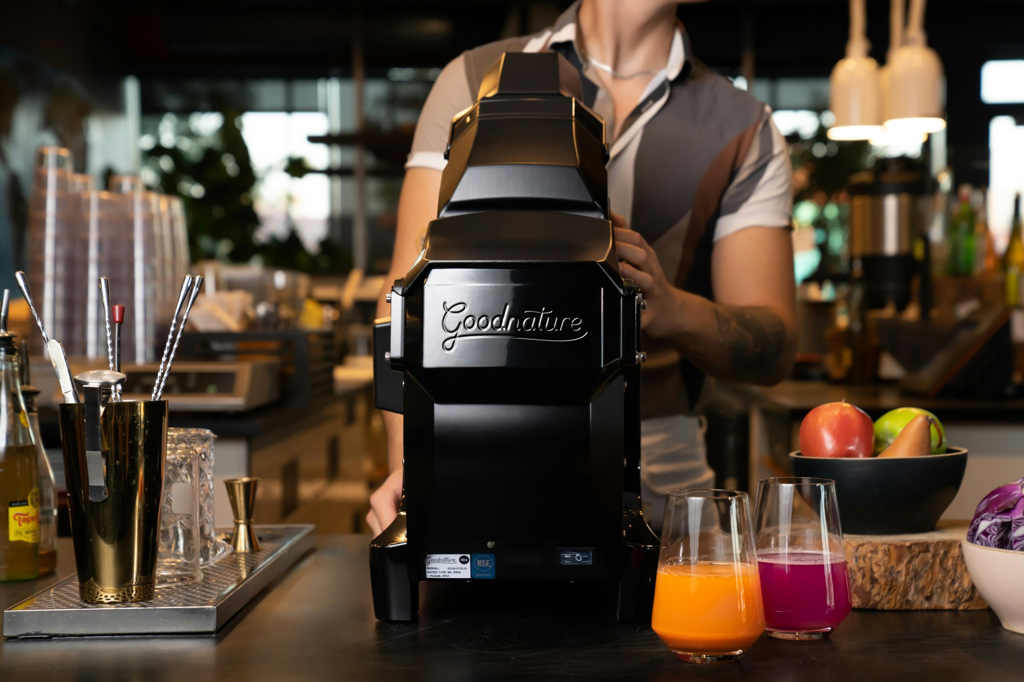 Goodnature M-1 commercial cold press juicer in a cafe coffee shop