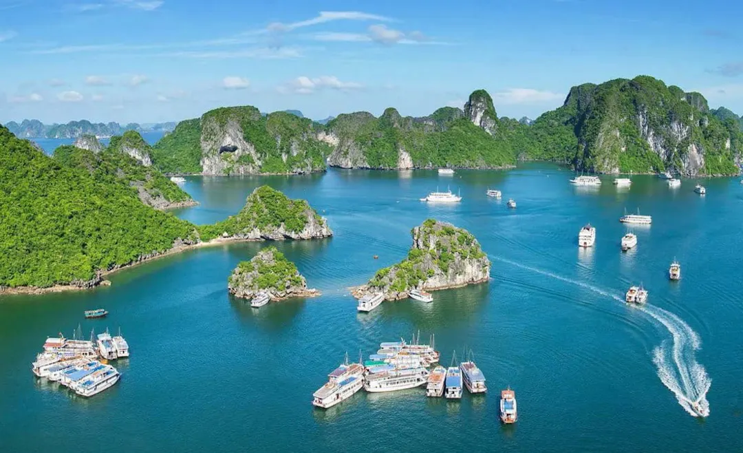 Limestone karst islands and turquoise water near Cat Ba National Park