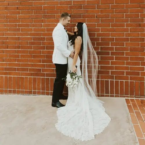 A bride facing her groom.