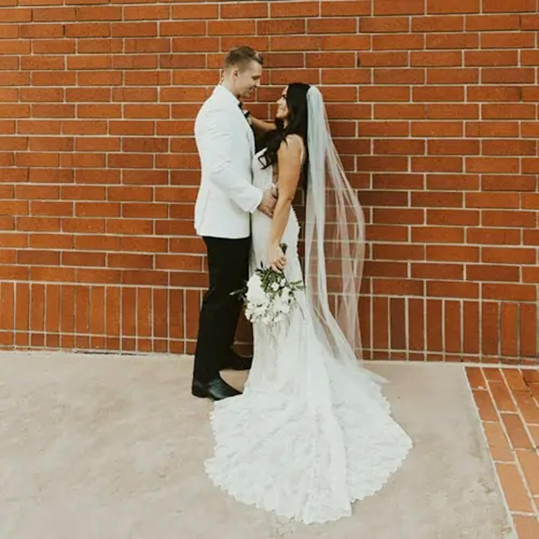 A bride facing her groom.