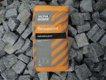 Bag of Flowpoint on a pile of Granite Setts