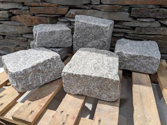 Oversized 200x200x100 Granite Setts on a pallet