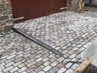 Garage entrance ramp using granite setts