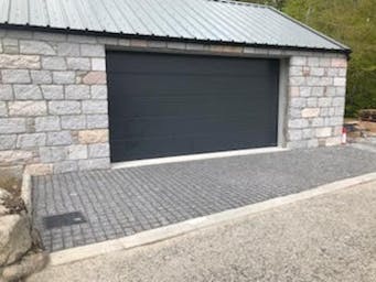 Medium Grey Granite Setts used for a garage entrance ramp