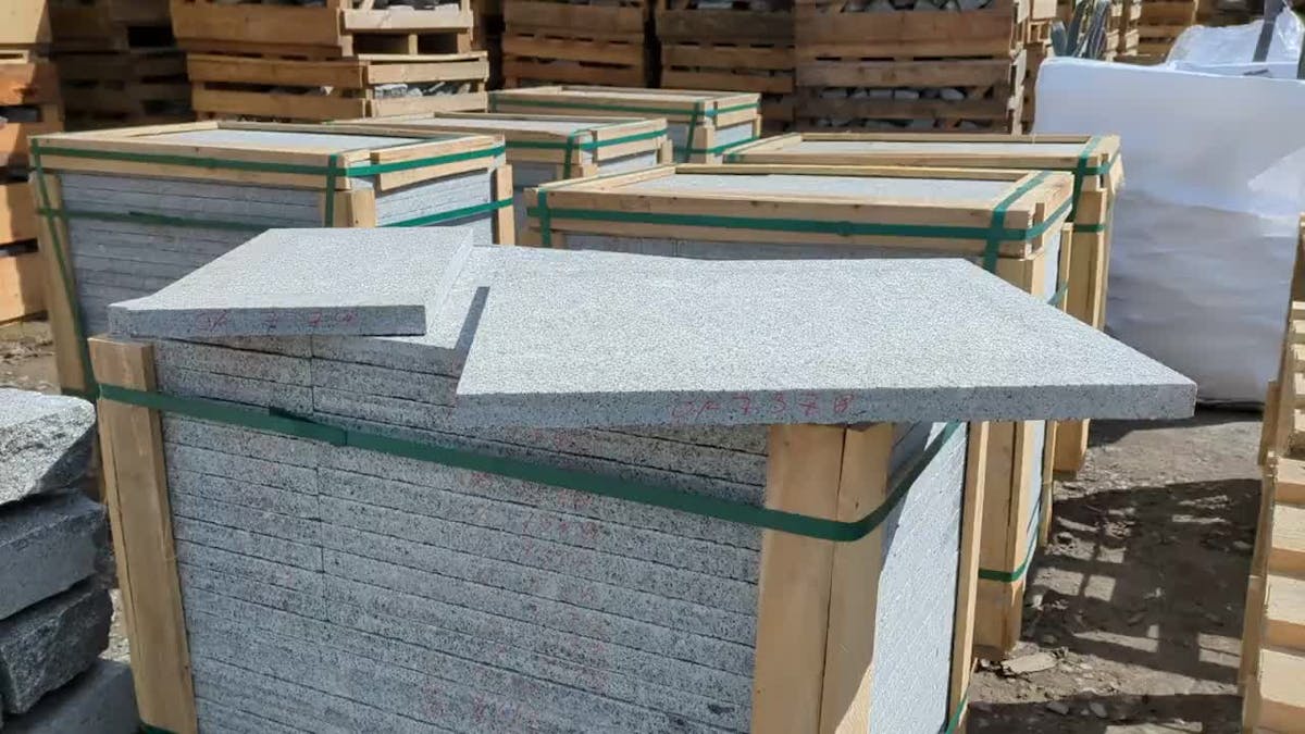 Wooden crate of flamed granite paving slabs