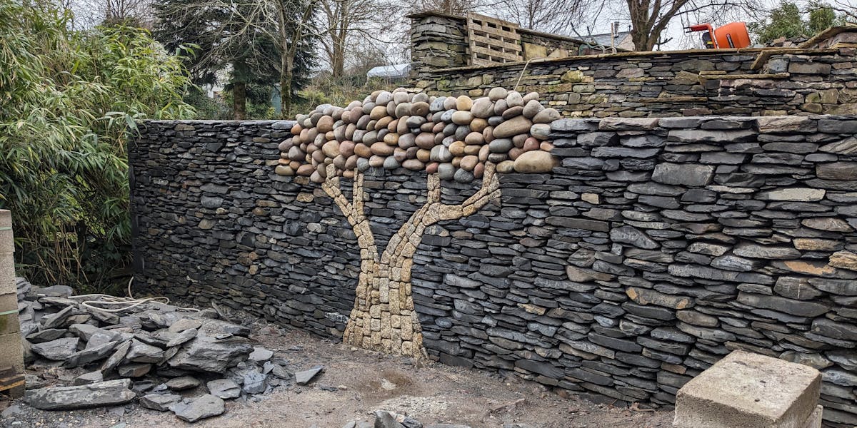Cobblestone tree embeded within a Lakeland wall
